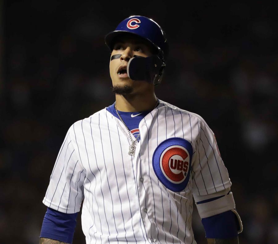 Javier Báez reacciona luego de pegar una línea de out en la cuarta entrada. (AP) (semisquare-x3)