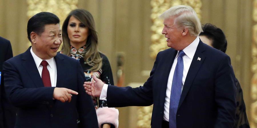 El presidente Donald Trump junto a su homólogo de China, Xi Jinping. (AP) (horizontal-x3)