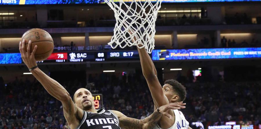 Williams (derecha) intenta detener a George Hill. (AP) (horizontal-x3)