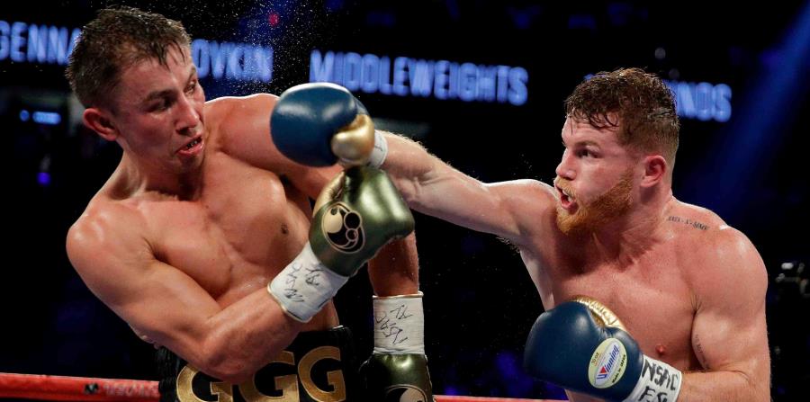 Gennady Golovkin (izq.) (37-0-1 con 33 nocauts) sigue entrenando para pelear el 5 de mayo, fecha festiva para los mexicanos residentes en Estados Unidos. (AP / John Locher) (horizontal-x3)