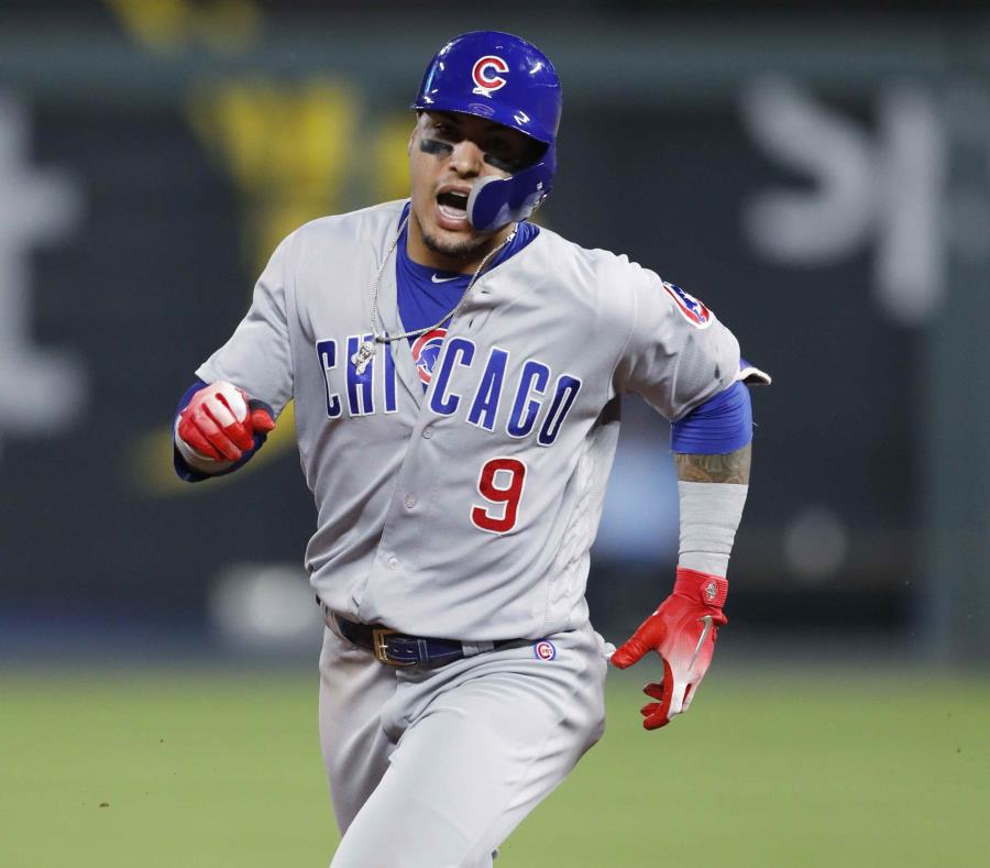 Javier Báez corre la bases después de su jonrón en la sexta entrada. (AP) (semisquare-x3)