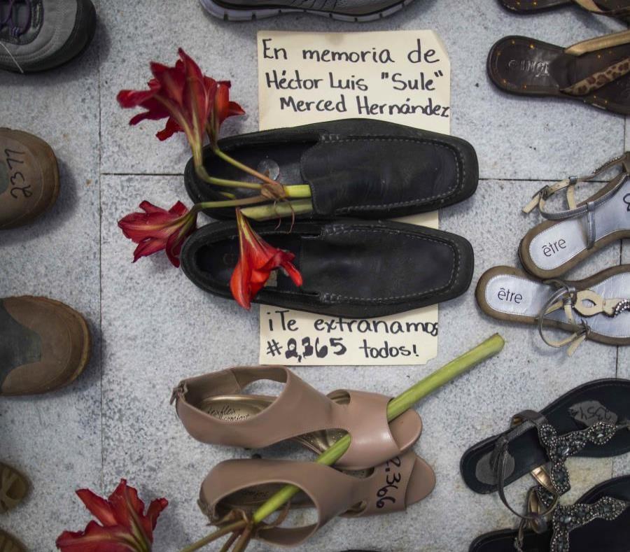Several shoes were placed at the Capitol in representation of all deaths caused by Hurricane Maria. (semisquare-x3)