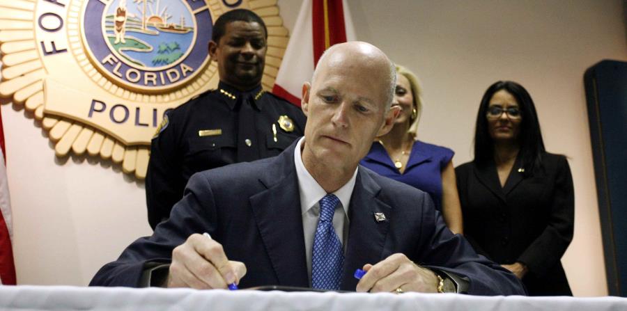 El gobernador de Florida, Rick Scott (horizontal-x3)