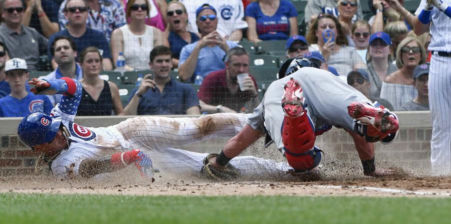 Báez se robó el home en la cuarta entrada. (AP) (horizontal-x3)