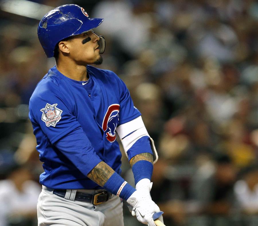 Javier Báez mira su cuadrangular de dos carreras en la primera entrada. (AP) (semisquare-x3)
