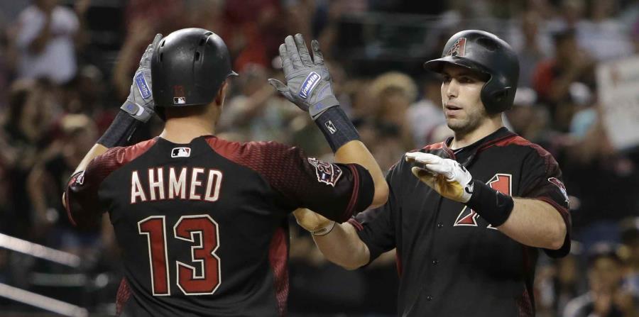 Paul Goldschmidt celebra con Nick Ahmed su cuadrangular de tres carreras. (AP) (horizontal-x3)