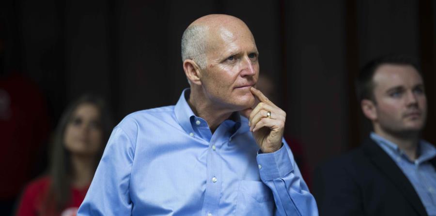El gobernador de Florida, Rick Scott (horizontal-x3)