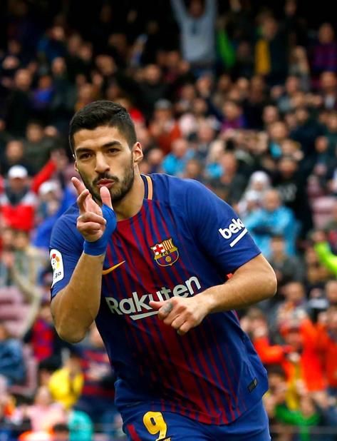 El astro uruguayo del Barcelona Luis Suárez celebra tras anotar un gol contra Valencia en un partido de La Liga española el sábado, 14 de abril del 2018. (vertical-x1)