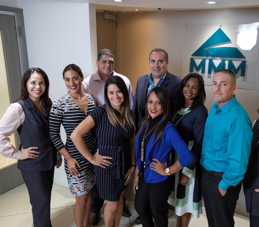 El equipo gerencial de MMM está en la foto. (semisquare-x3)