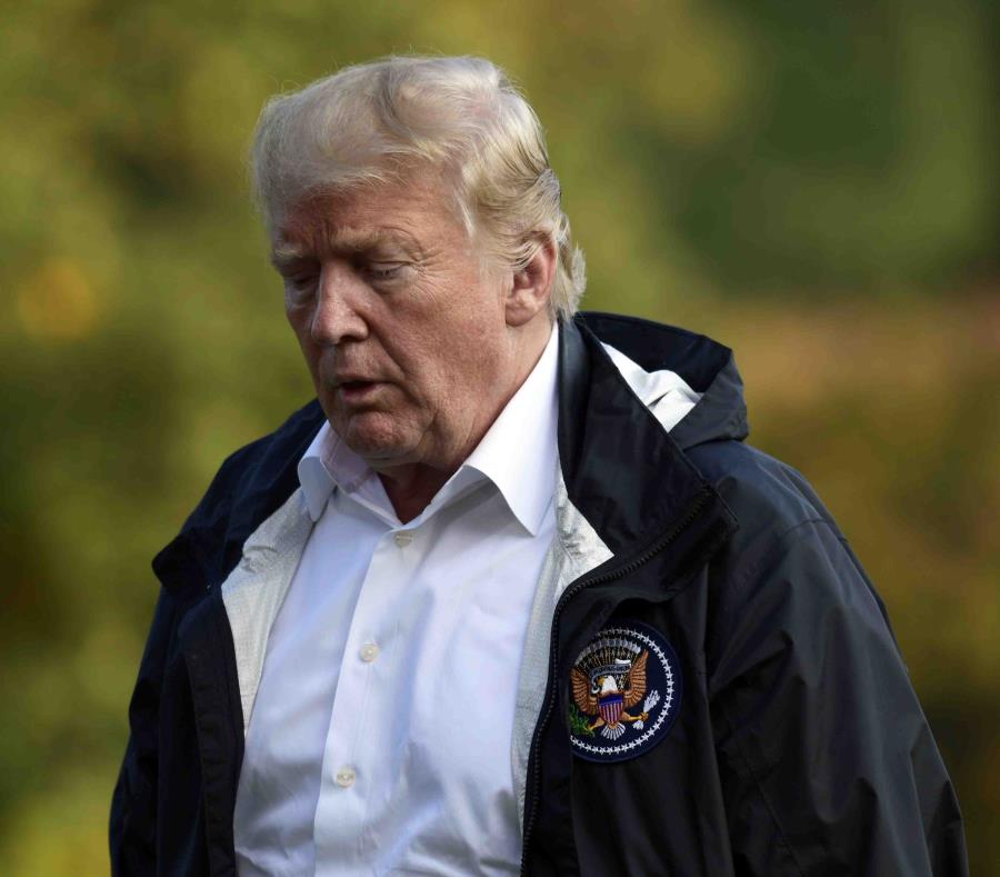 Donald Trump a su llegada a la Casa Blanca tras su viaje a Carolina del Norte y Sur para ver los daños del huracán Florence. (AP) (semisquare-x3)