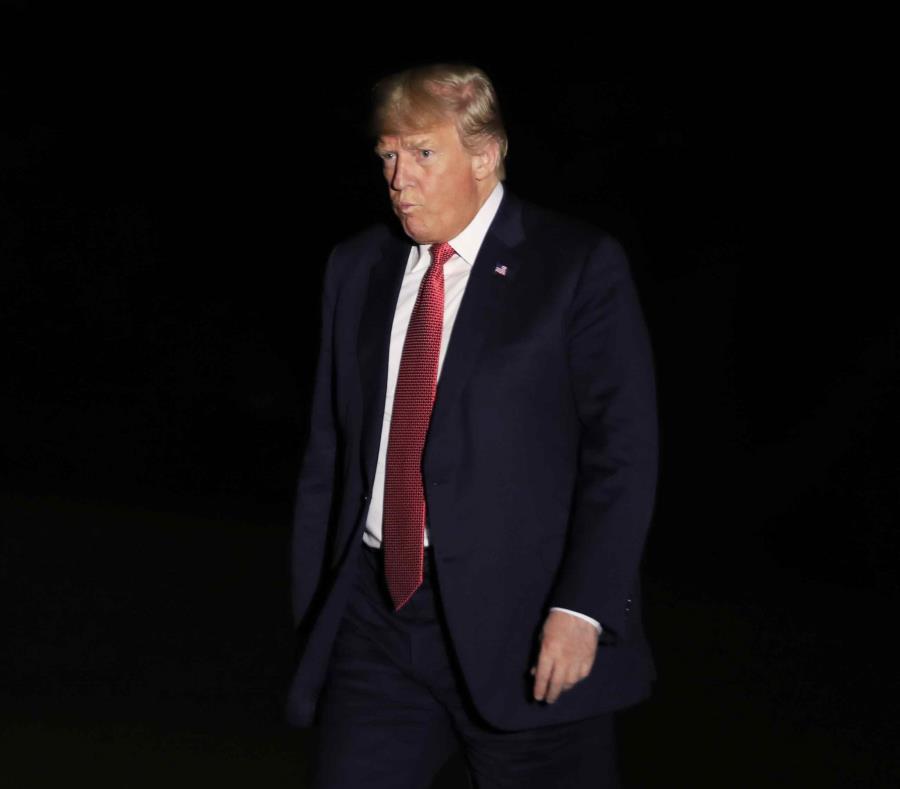 Donald Trump mientras arribaba anoche a la Casa Blanca. (AP) (semisquare-x3)