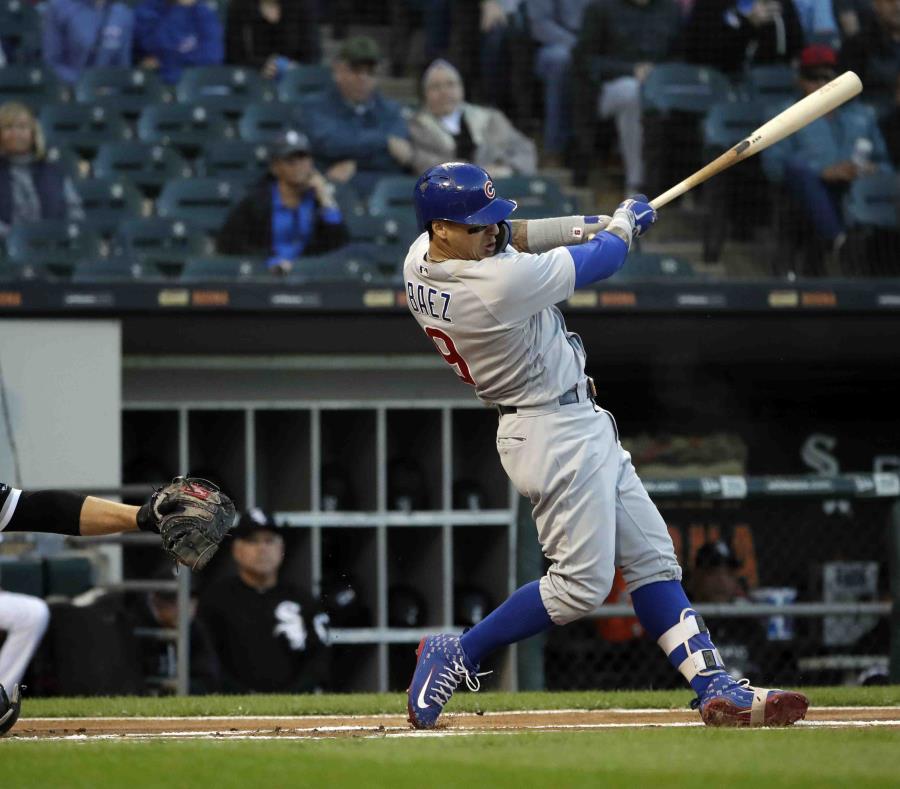 Javier Báez pega un jonrón de tres carreras en la primera entrada. (AP) (semisquare-x3)